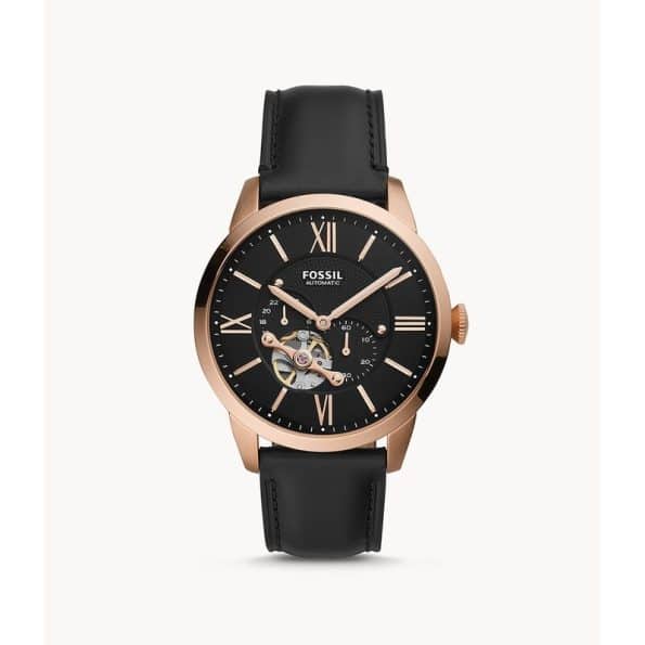 "Analog wristwatch with stainless steel case and leather strap by Fossil."